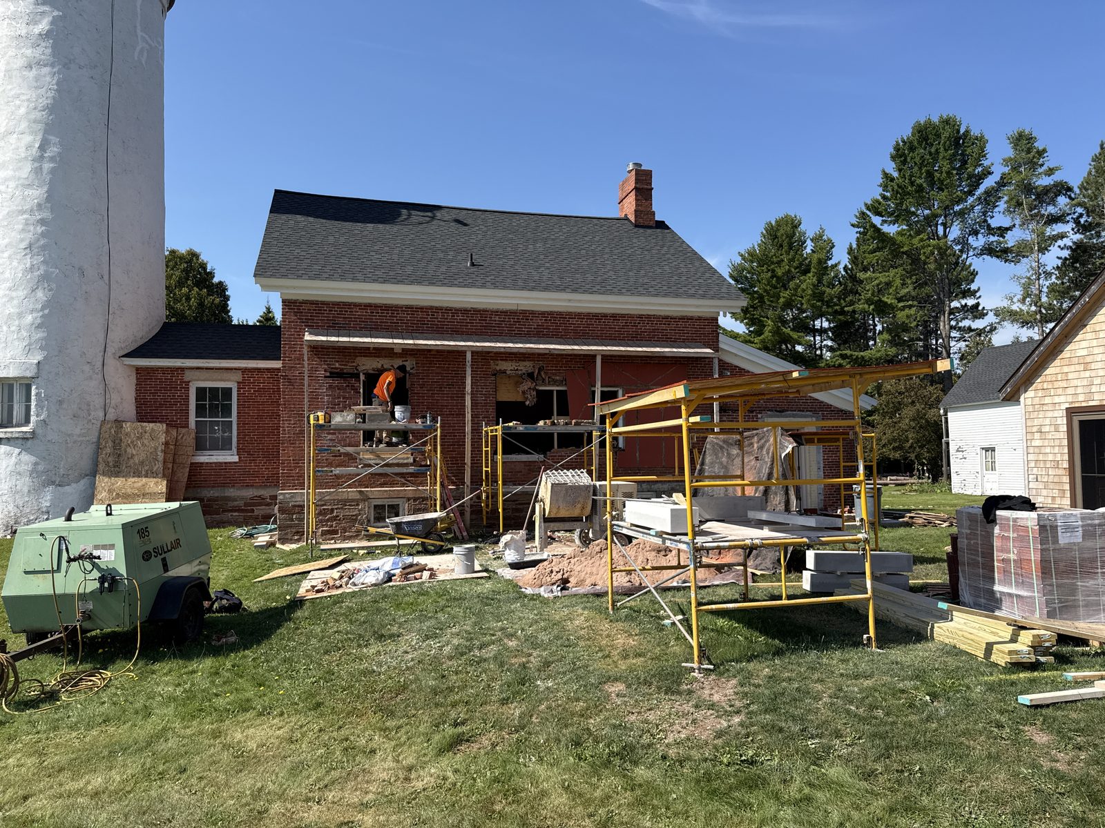 Scaffolding against the brick keeper's house during restoration